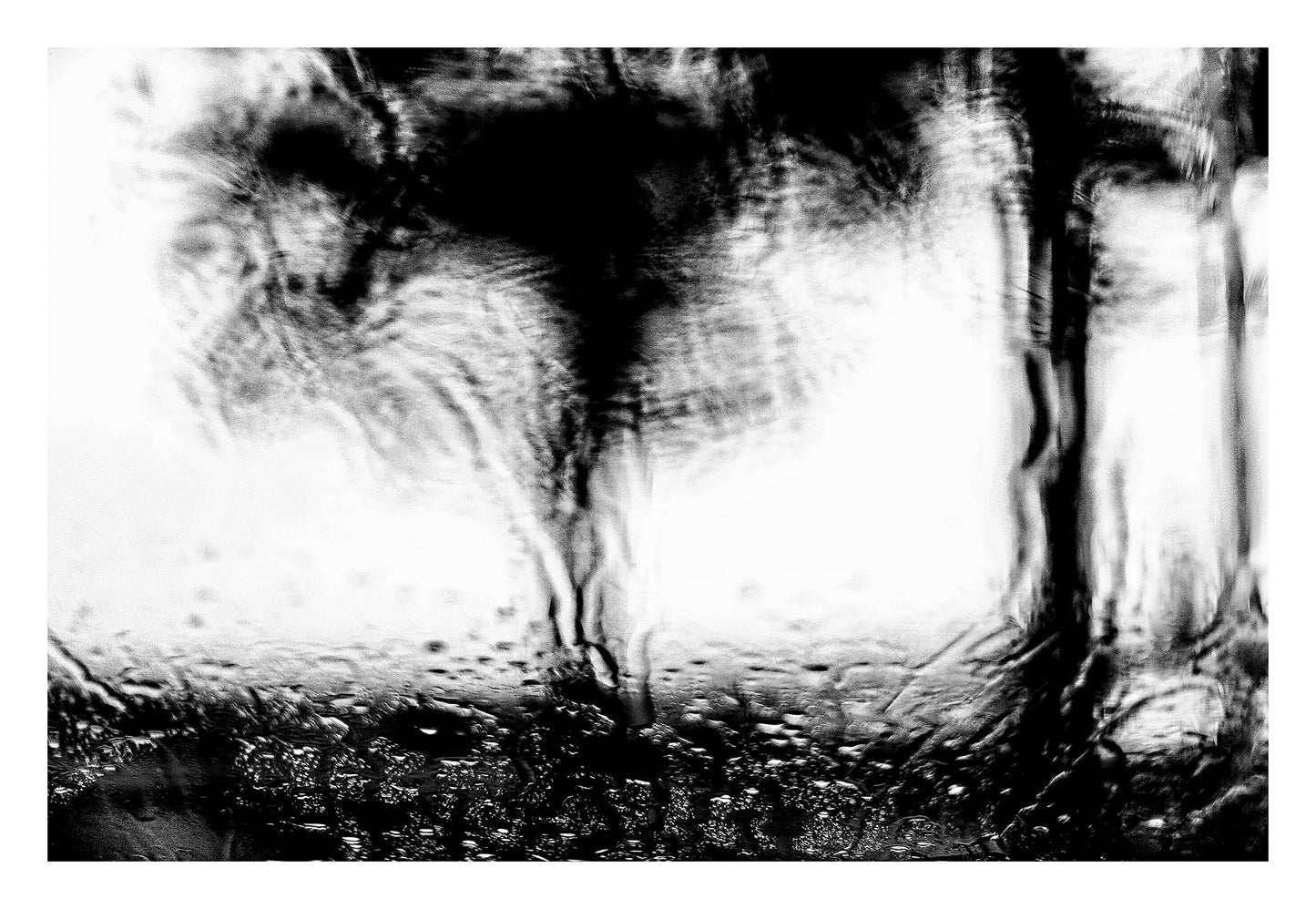 Coastal Noir 7221 - 104x74cm, black and white coastal scene with blurred jetty and trees through rain-speckled glass, abstract minimalist print.