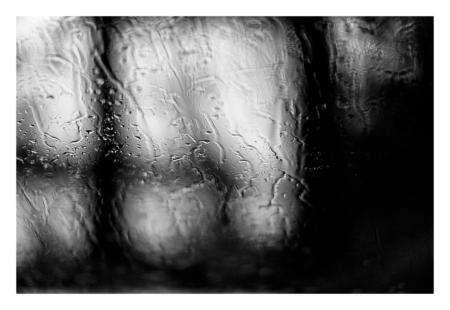 Coastal Noir 8017 - 104x74cm, abstract monochrome photograph of blurred coastal trees seen through rain-dappled glass, minimalist print.