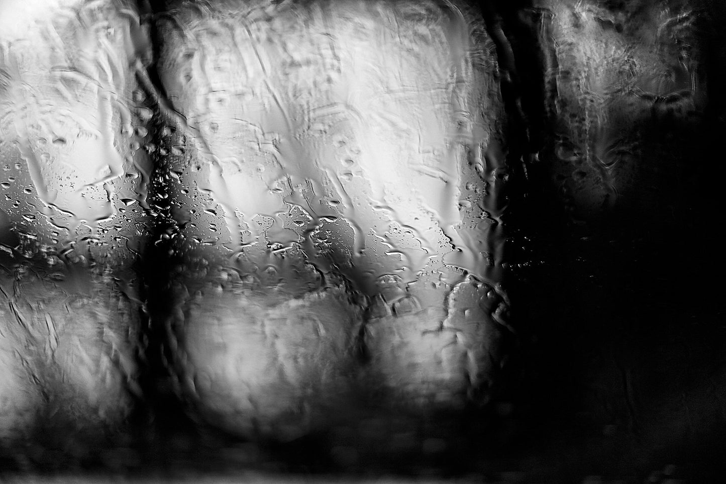 Coastal Noir 8017 - 90x60cm, abstract monochrome photograph of blurred coastal trees seen through rain-dappled glass, minimalist print.