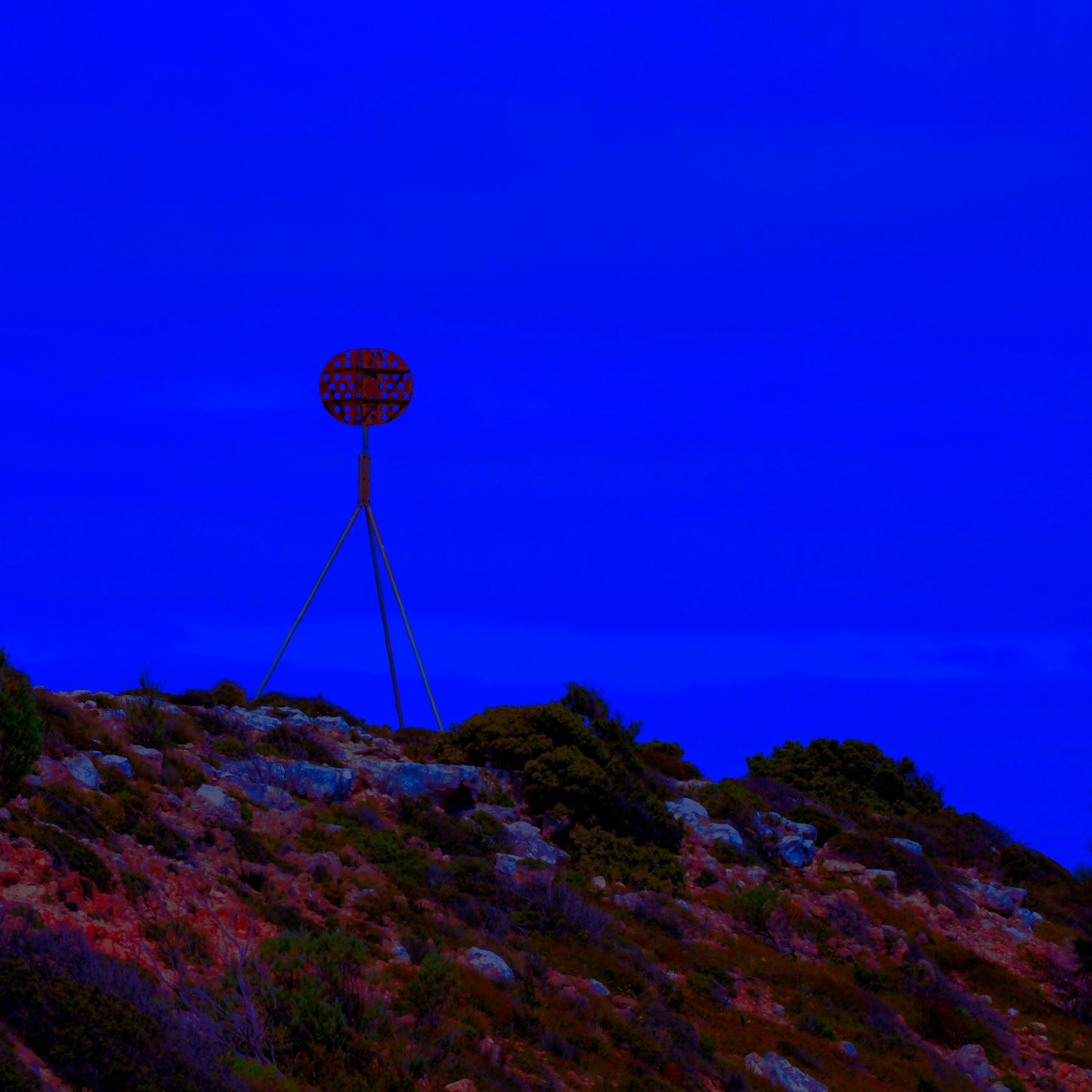 Vivid Country - Cape Jervis Heysen Trail - 7290v2 - Close Detail View, a lone marker on the Heysen Trail stands atop a rocky hill under a vivid cobalt blue sky, evoking solitude and direction on South Australia’s coast.