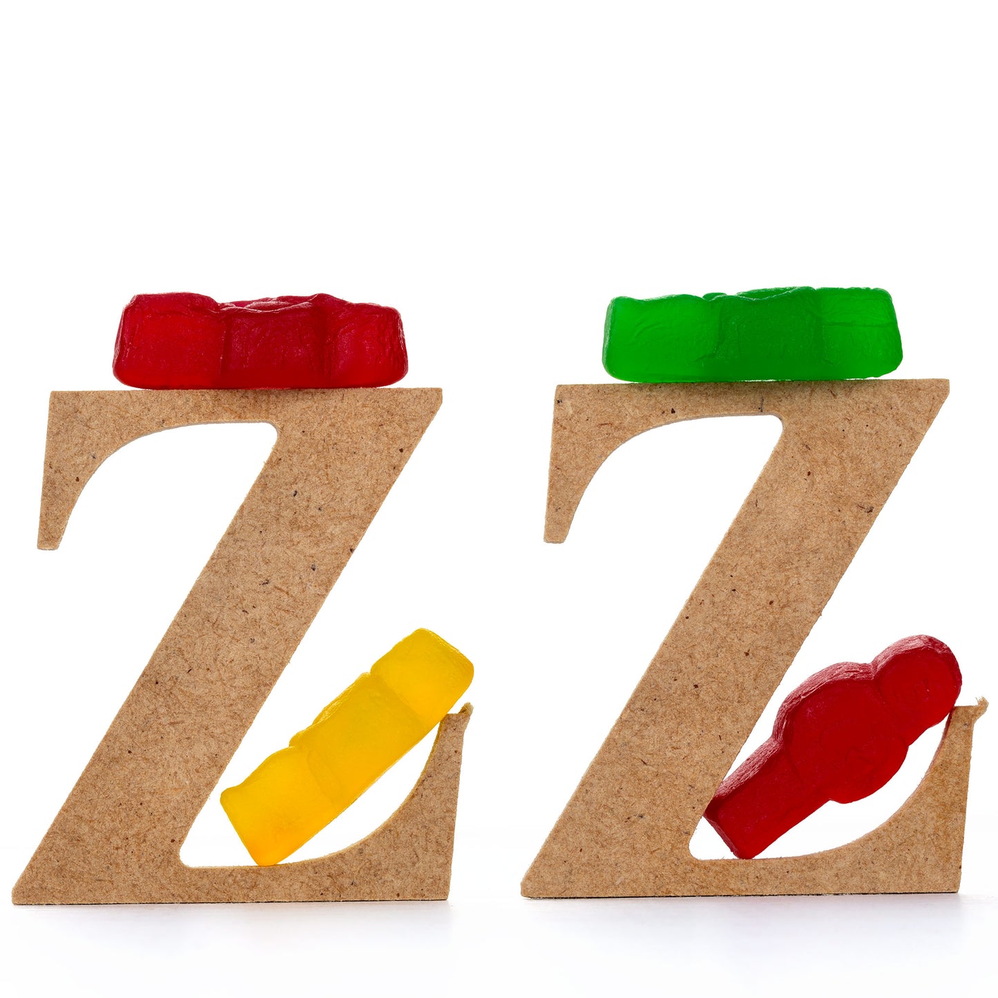 Catching Some ZZZ’s 1501 - Close Detail View, playful fine art photograph featuring three wooden letter Zs each topped with gummy bears and supported by colourful jelly baby figures, part of the Cliché Life series by Raymond Mather, ART1.