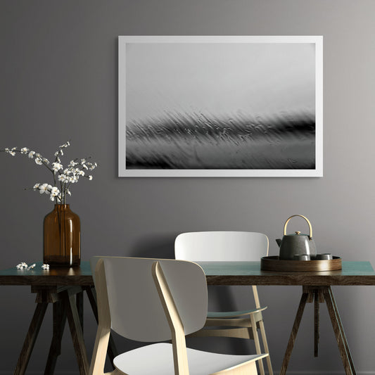 Coastal Noir 7669 - Room View, monochrome photograph of rippling water and shoreline blurred by rain droplets on glass, minimalist abstract coastal print.