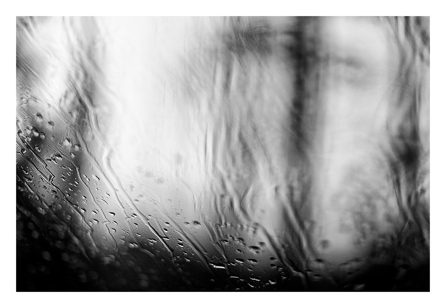 Coastal Noir 7924 - 104x74cm, black and white minimalist coastal photograph with delicate rain droplets on glass creating abstract textures.