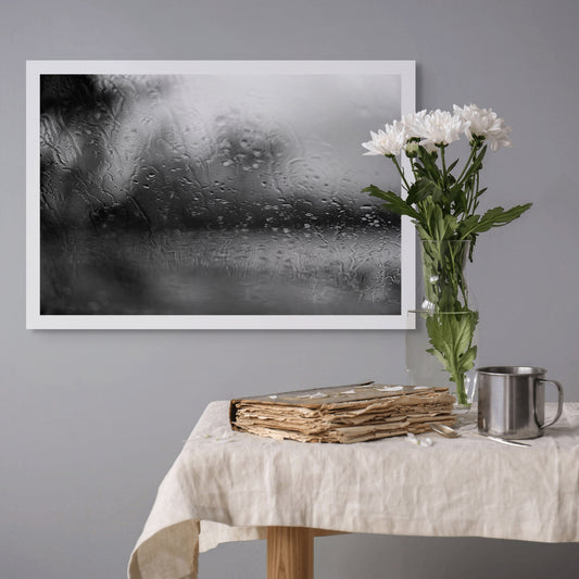 Coastal Noir 7974 - Room View, black and white coastal photograph with rain-speckled glass creating soft abstract forms and horizontal flow.