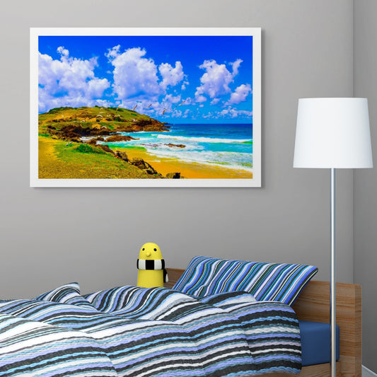 Vivid Country - Coffs Harbour Gallows Beach & Corambirra Point - 1203-2v6 - Room View, a vibrant coastal landscape with soaring seagulls, a rocky headland, vivid blue ocean, and golden sands beneath a bright cloud-filled sky.