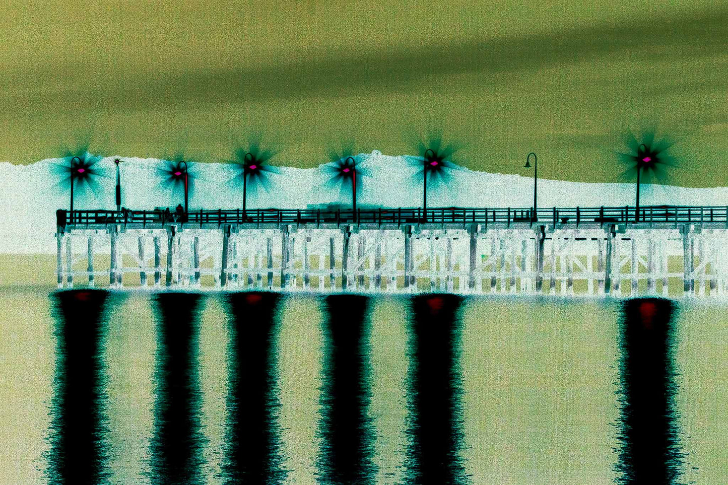 Vivid Country - Coffs Harbour Jetty Lights - 6900033v33a - 90x60cm, an ethereal nighttime view of the Coffs Jetty with bright starburst lights casting vivid pink and green reflections across still waters in a surreal, digitally enhanced composition.