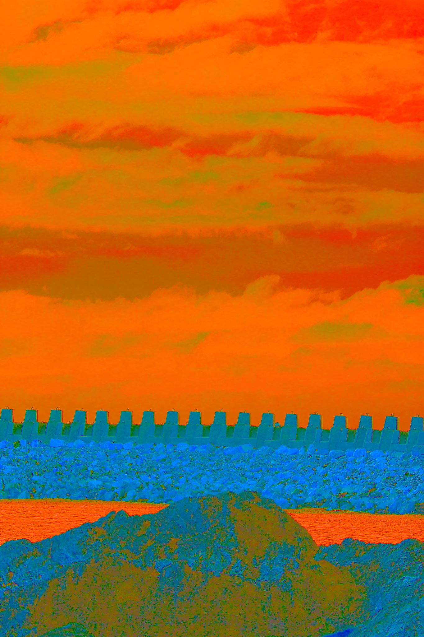 Vivid Country - Coffs Harbour South Breakwall - 6111v7 - 60x90cm, a vividly stylised photograph of a concrete breakwall beneath a blazing orange and green sky, with layers of rocky land and glowing water in the foreground.