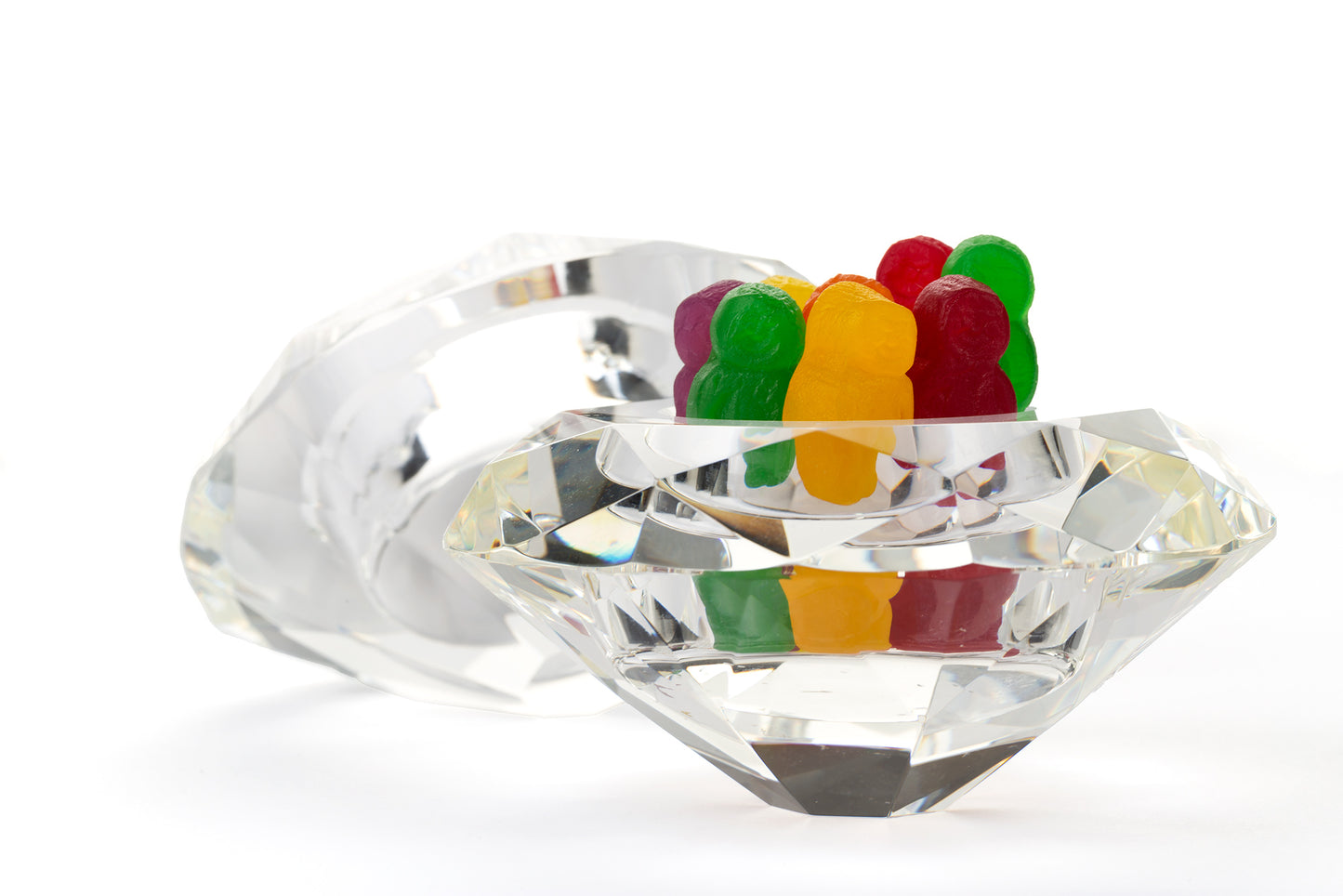 Diamonds Are 1643 - 90x60cm, colourful jelly baby figures standing upright in a large faceted crystal bowl shaped like a diamond, with a second gem behind, fine art photograph by Raymond Mather, ART1.