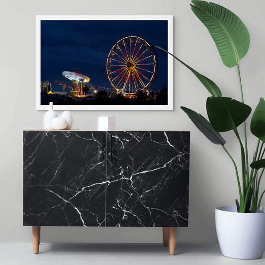 Fairground Carnival Lights 6900003v3 - Room View, Ferris wheel glowing against twilight sky with carnival rides below, fine art limited edition print by Raymond Mather, ART1.