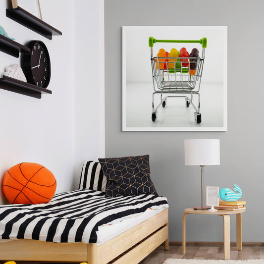 Gone Shopping 2303v1 - Room View, colourful jelly baby figures packed neatly inside a miniature chrome shopping trolley with green handles, staged on a clean white background, fine art photography by Raymond Mather, ART1.
