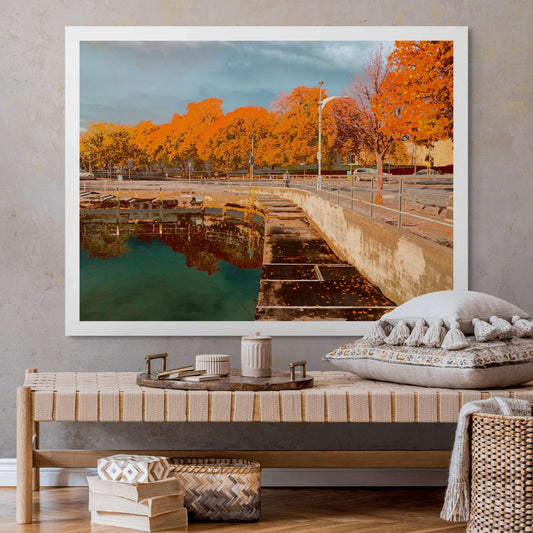 Vivid Country - Hobart Waterfront Esplanade - 0119v11a - Room View, a richly coloured Pop Art-inspired view of Hobart’s waterfront showing a calm harbour edge, autumn leaves on the pavement, and a vibrant row of golden-orange trees under a grey-blue sky.