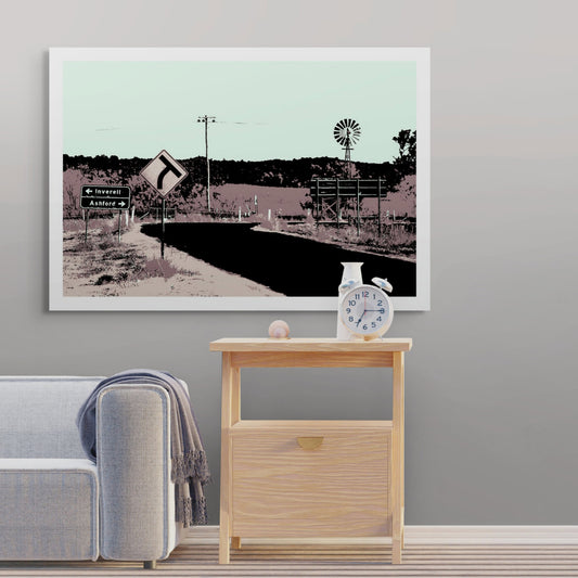 Vivid Country - Inverell Windmill Signs - 5080v21 - Room View, a stylised Pop Art image of a rural Australian road intersection with signs pointing to Inverell and Ashford, a windmill, and distant hills in a pastel palette.