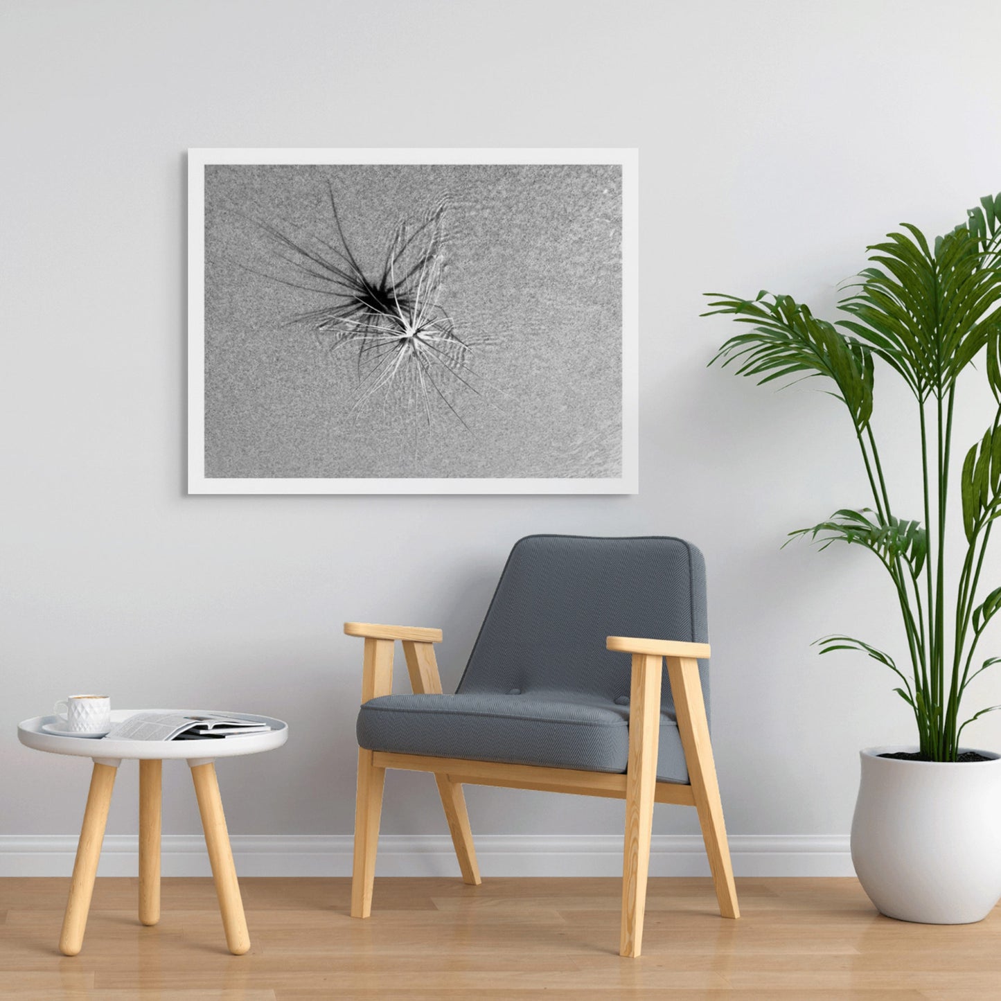 Monochrome Mix - Beach - Spinifex - 184003 - Room View, A coastal spinifex plant resting on textured sand, its long blades casting radial shadows in black and white. Minimalist natural geometry. Limited edition fine art print.