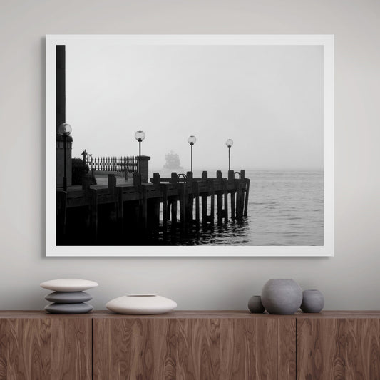 Monochrome Mix - Ferry in the Mist - 1720675 - Room View, A ferry appears through heavy mist beyond a quiet dock with vintage lamp posts, rendered in soft black and white. Moody, atmospheric waterscape Sydney Harbour. Limited edition fine art print.