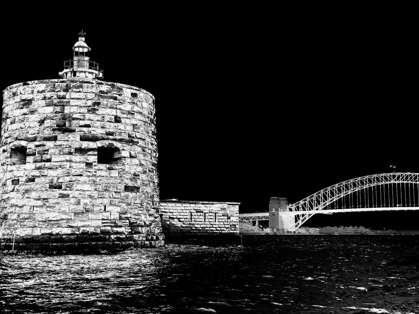Monochrome Mix - Sydney - Fort Denison - Pinchgut Island - 209617v22a - 90x67.5cm, Black and white photo of Fort Denison in Sydney Harbour with the Harbour Bridge in the background; high contrast night sky and rippling water in the foreground.