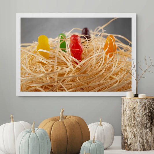 Needle in a Haystack 2523v1 - Room View, conceptual fine art photograph by Raymond Mather featuring colourful jelly baby figures nestled in straw with a real sewing needle subtly placed, playfully reimagining the classic idiom in vibrant pop art style.