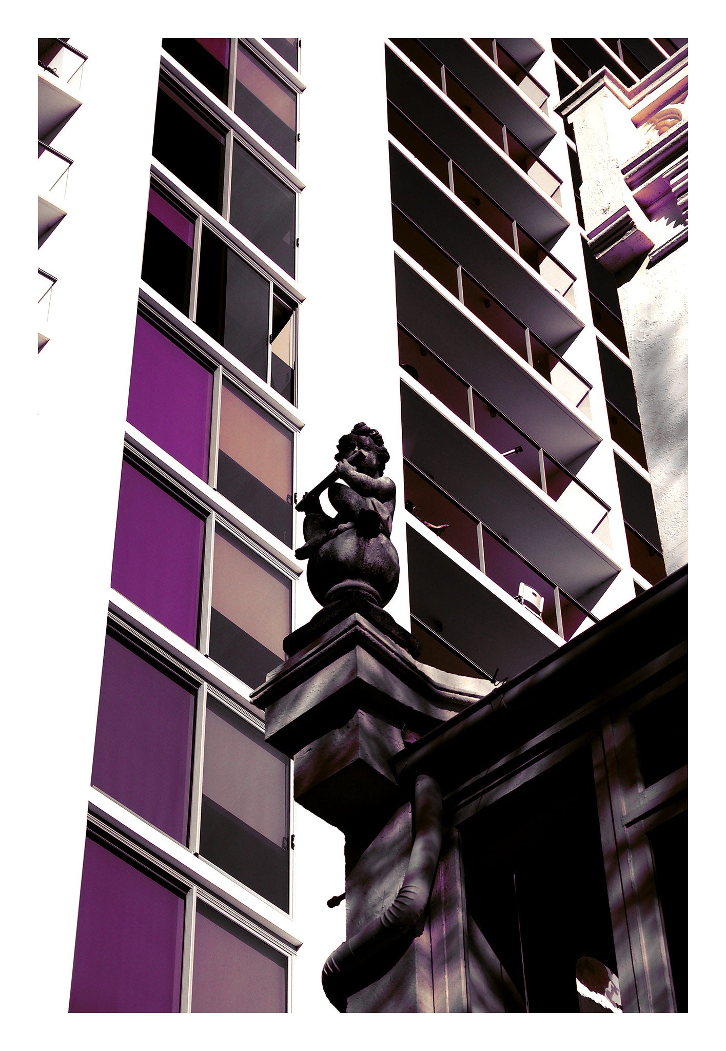 POPscape Sydney - Darlinghurst - Building Statue - 1906064v16 - 74x104cm, Stylised image of a cherub statue atop a heritage building, surrounded by modern high-rise architecture in Darlinghurst. Muted purples and dark tones create dramatic Pop Art contrast.
