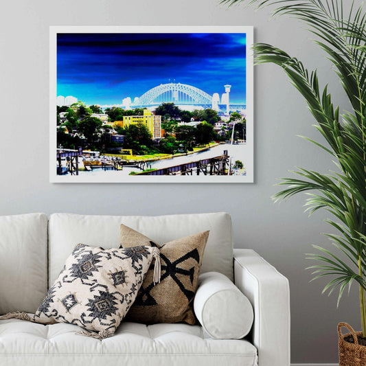POPscape Sydney - Harbour Bridge View - 190022v89 - Room View, Vibrant stylised view of Sydney Harbour Bridge with saturated blue sky, suburban rooftops, and a bold yellow building in the foreground overlooking the water.