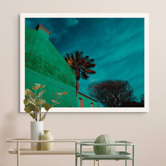 POPscape Sydney - Paddington - Palm - 8780v12 - Room View, Stylised urban scene featuring a palm tree and leafless tree beside a flat green wall under a rich blue sky. Bold colour treatment and strong architectural lines in Pop Art style.