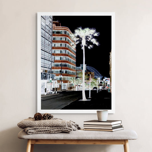 POPscape Sydney - Pitt Street - Palm - 229180v3b - Room View, Stylised scene of Pitt Street, Sydney, featuring a glowing palm tree in the foreground, modern buildings, streetlights, pedestrians, and a glimpse of the Harbour Bridge in high-contrast inverted tones.