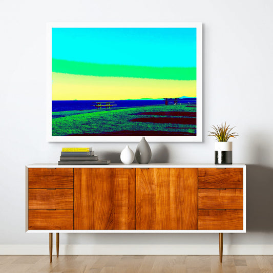 Vivid Country - Sawtell - Bonville Headland Lookout - 1704v25 - Room View, Fine art pop-style landscape featuring picnic tables on grassy cliffs at Bonville Headland Lookout, Sawtell, with a vivid sky in gradients of aqua, green, and yellow above a deep blue ocean.