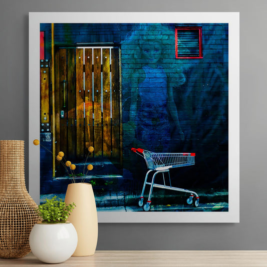 Trolley Dolly - Series No.2: 19E2255v12 - Room View, a translucent doll like woman with blonde hair is layered against a dark blue brick wall. A red handled shopping trolley sits at the curb, and a wooden slatted door glows with hints of fruit and market textures. The scene symbolises homelessness, invisibility, and social neglect.