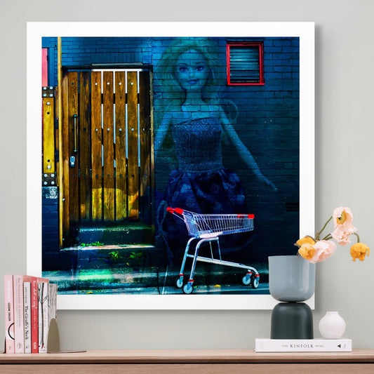 Trolley Dolly - Series No.2: 19E2255v6 - Room View, a translucent doll with blonde hair and a patterned dress is superimposed over a dark brick wall. A red-handled shopping trolley sits nearby, beside a wooden door layered with faint fruit textures. The composition explores invisibility, fragility, and homelessness through symbolic, layered imagery.