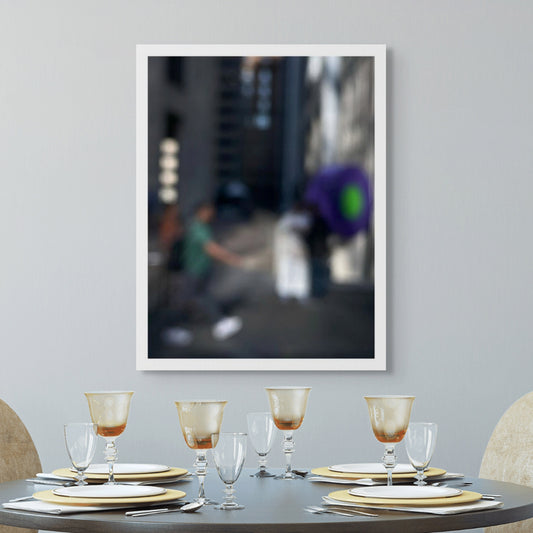 Urban Commute - Series No.1: 0960v1 - Room View, a soft-focus image of a city commuter mid-stride beside a vivid purple umbrella, set between tall buildings in gentle light. An abstracted urban moment captured in motion. Limited edition fine art print by Raymond Mather.