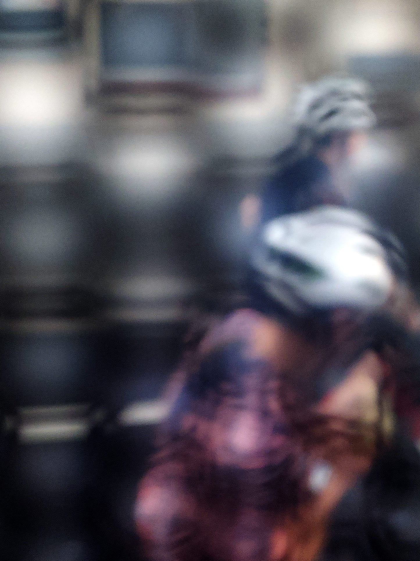 Urban Commute - Series No.2: 8622(1) - 67.5x90cm, fine art photograph by Raymond Mather featuring two blurred cyclists in motion, seen through a diffused surface. The image blends pink, navy, and silver tones into an abstract composition of rhythm, reflection, and fleeting urban energy.