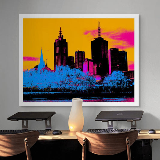 Vivid Country - Melbourne City Skyline - 0218v7a - Room View, a bold Pop Art reimagining of Melbourne’s skyline featuring skyscrapers, heritage domes, and church spires set against a vivid orange pink sky and glowing blue treetops.