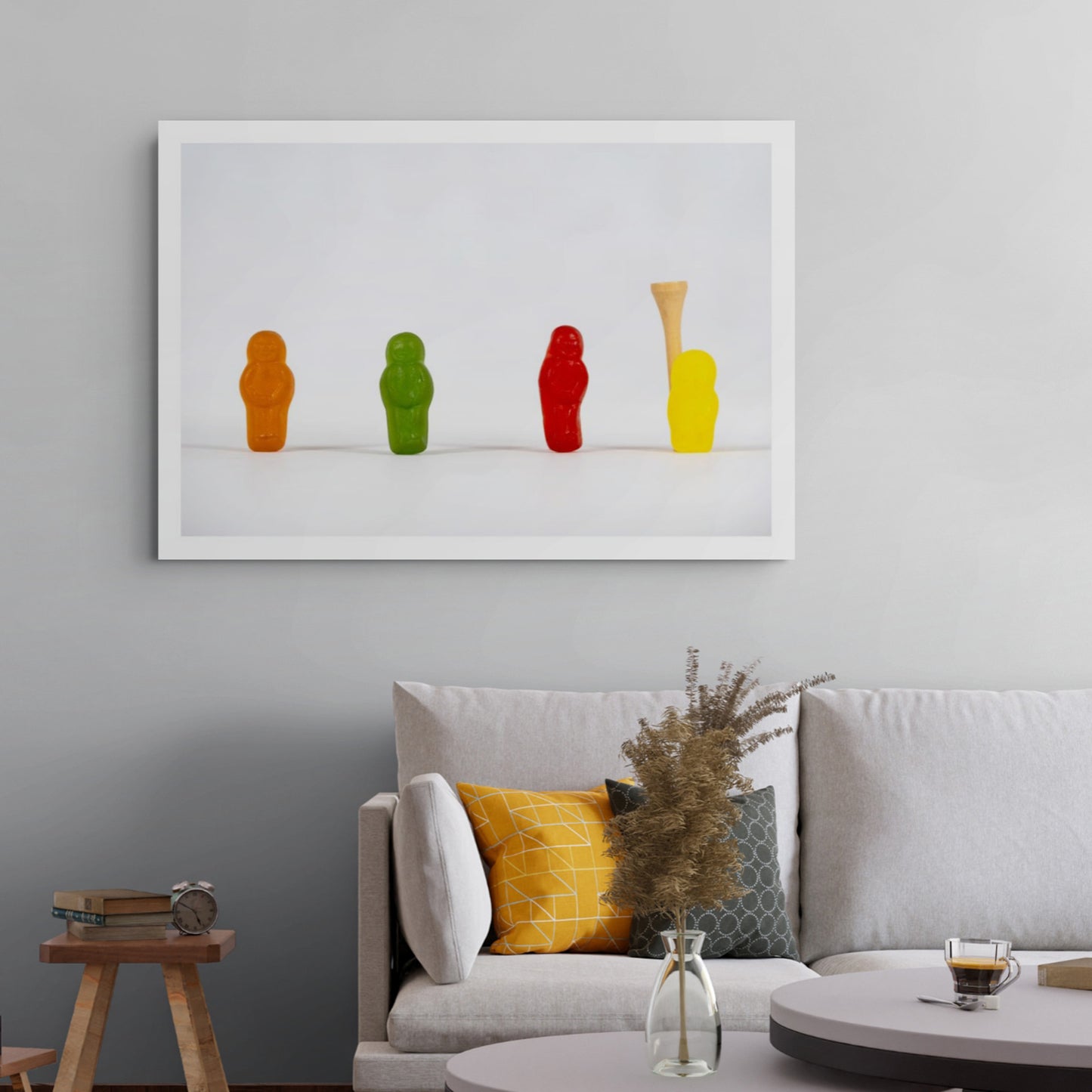 Teeing Off - 267089v1 photographic artwork featuring four colourful confectionery figures and a wooden golf tee against a white background, displayed in a contemporary interior.