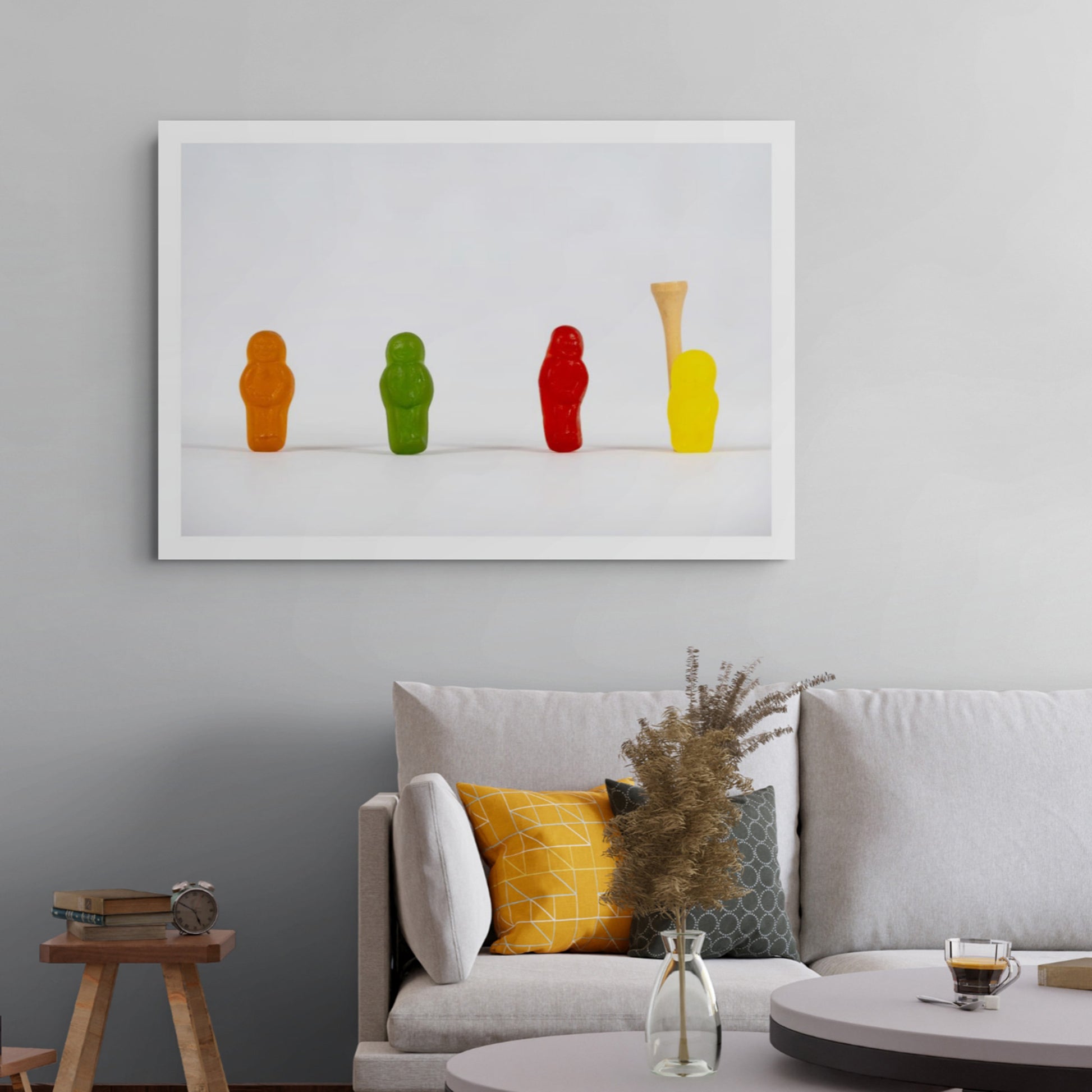 Teeing Off - 267089v1 photographic artwork featuring four colourful confectionery figures and a wooden golf tee against a white background, displayed in a contemporary interior.