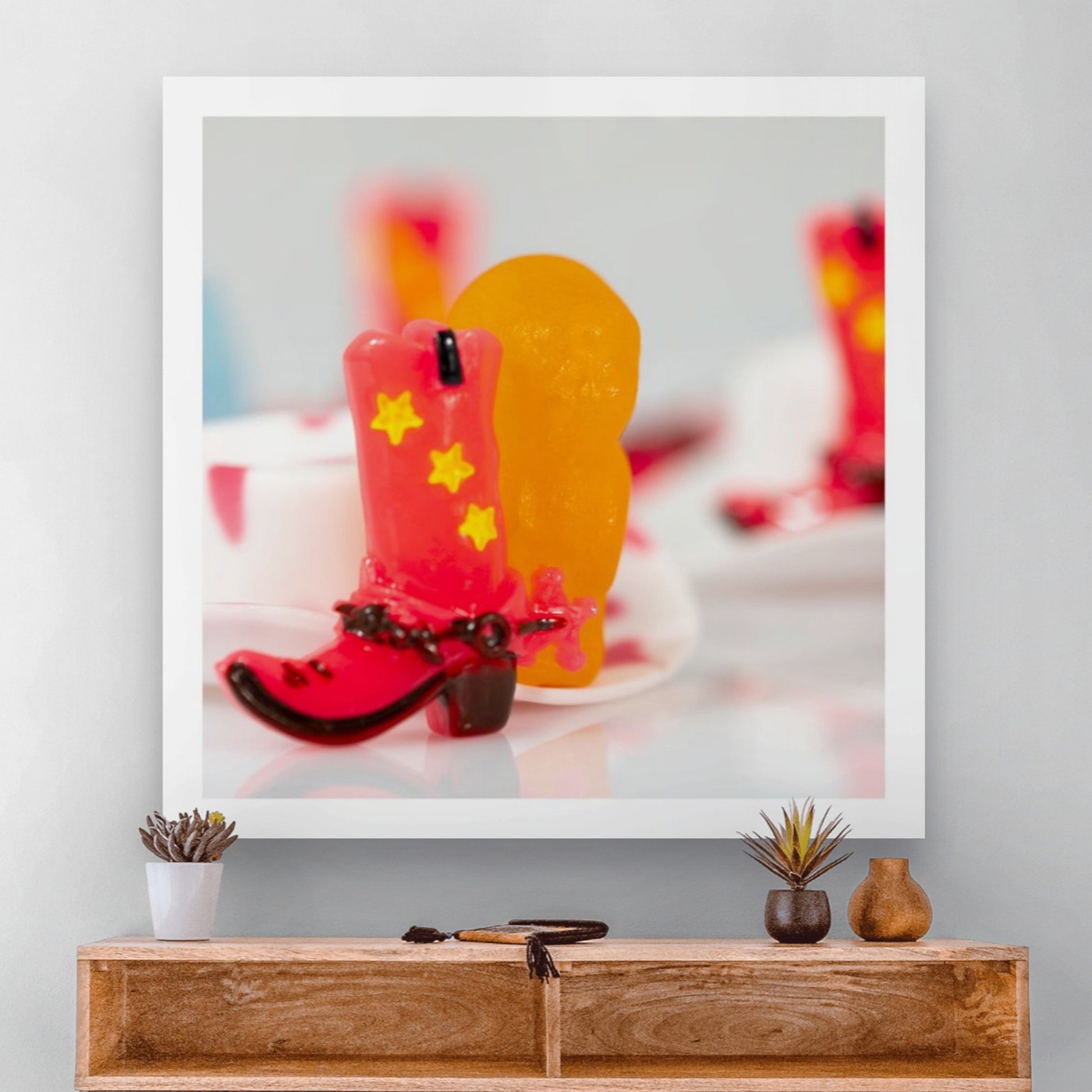 Boot Scootin’ Baby 266841v1 by Raymond Mather displayed as a square photographic artwork above a timber console in a contemporary neutral interior.
