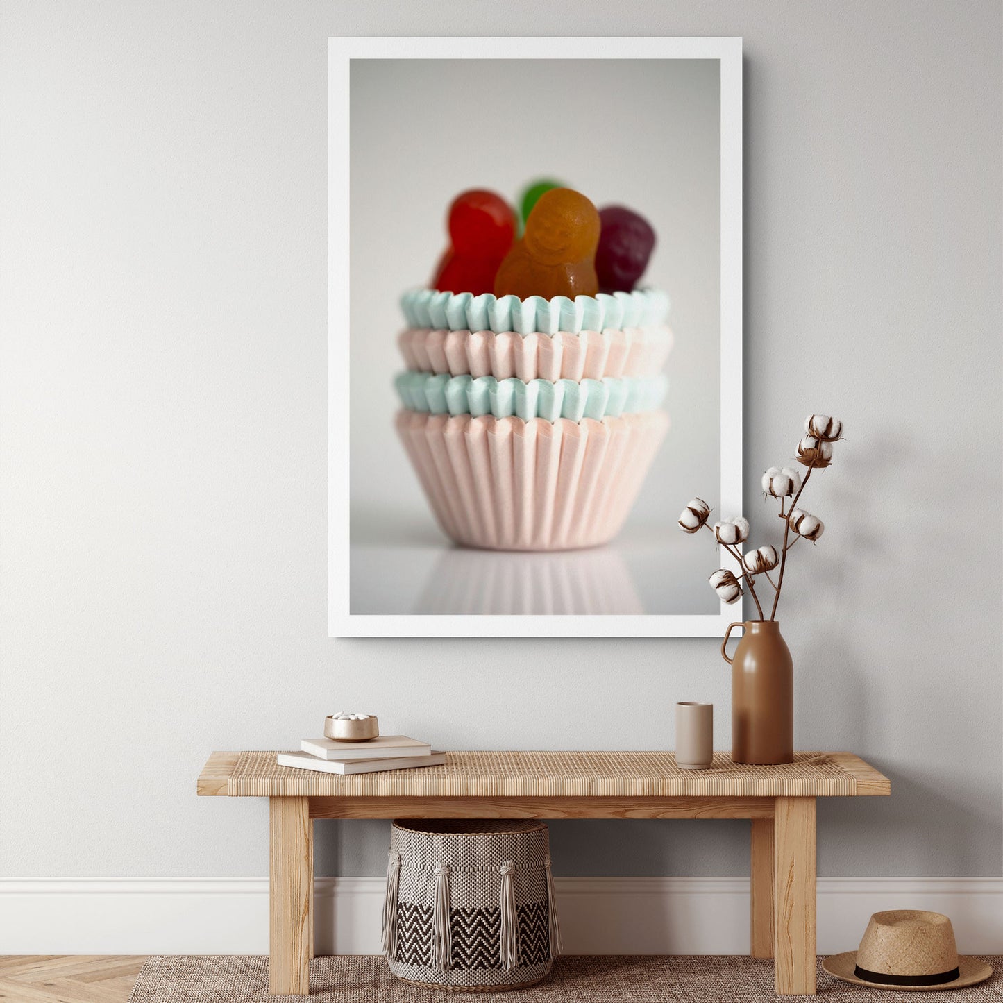 Cupcakes - 266660v1 displayed as a large vertical photographic artwork above a timber console in a neutral contemporary interior.