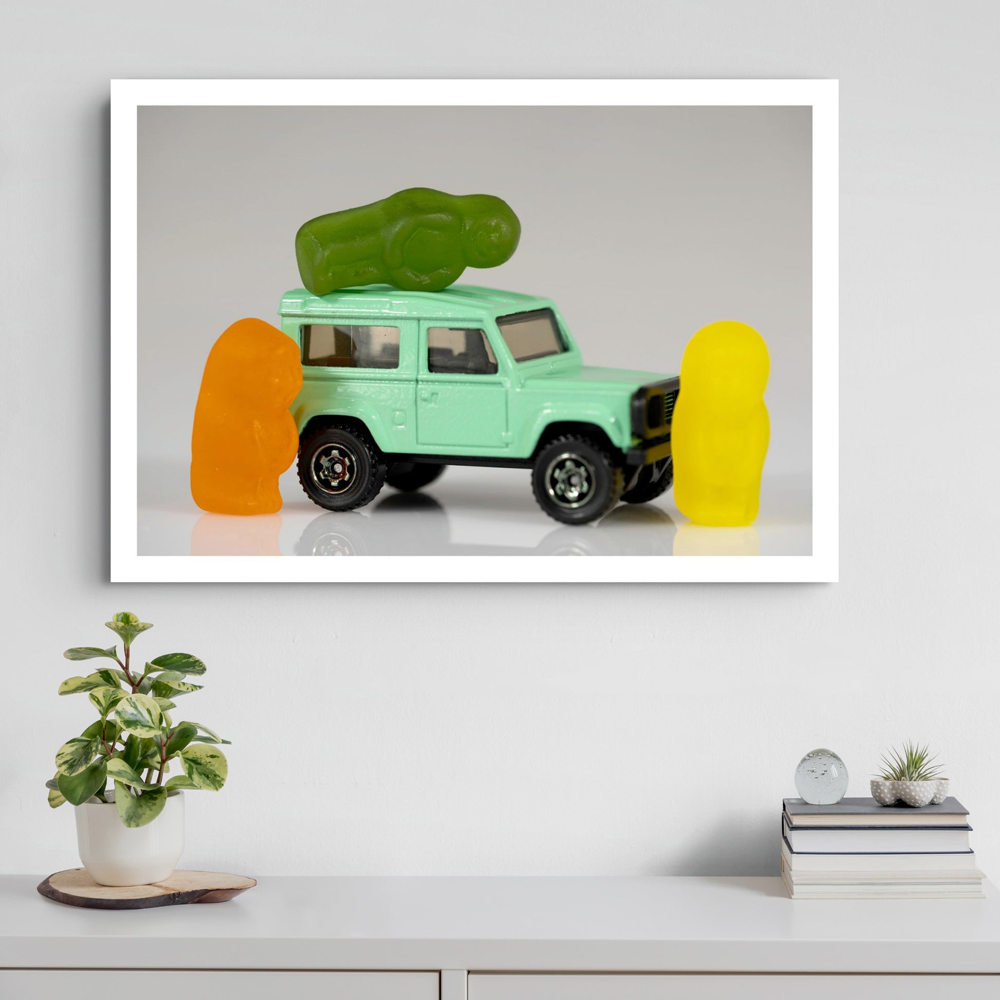Jump In My Car - 266627v1 displayed as a large horizontal photographic artwork above a white cabinet in a contemporary interior.
