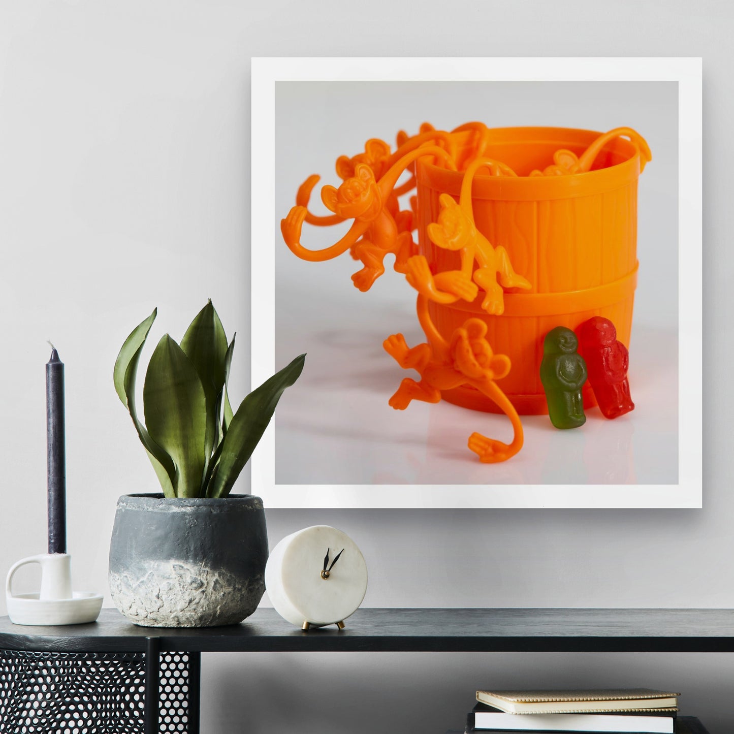 Let’s Monkey Around - 266679v1 displayed as a square photographic artwork above a dark console with plants and decorative objects.