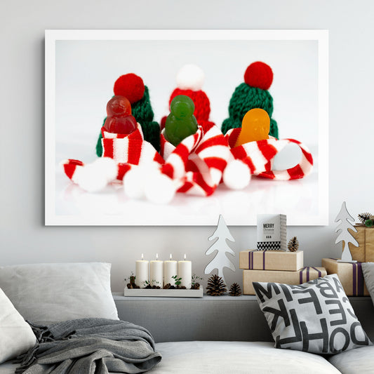 Santa Babies photographic artwork showing three colourful miniature figures among Christmas scarves and knitted hats displayed in a contemporary living room.