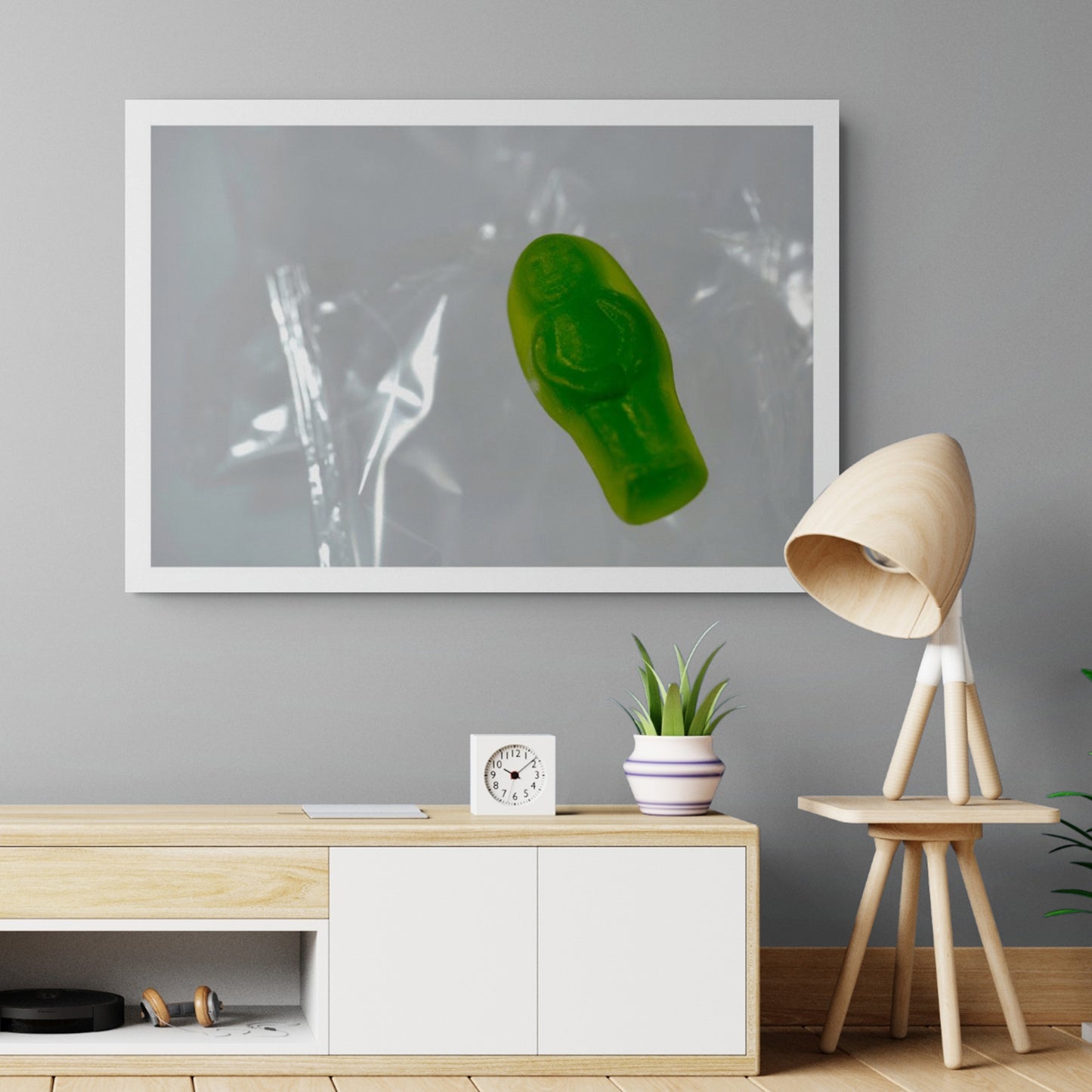 Sleep Like A Baby photographic artwork featuring a solitary green translucent baby-shaped figure displayed in a contemporary interior.