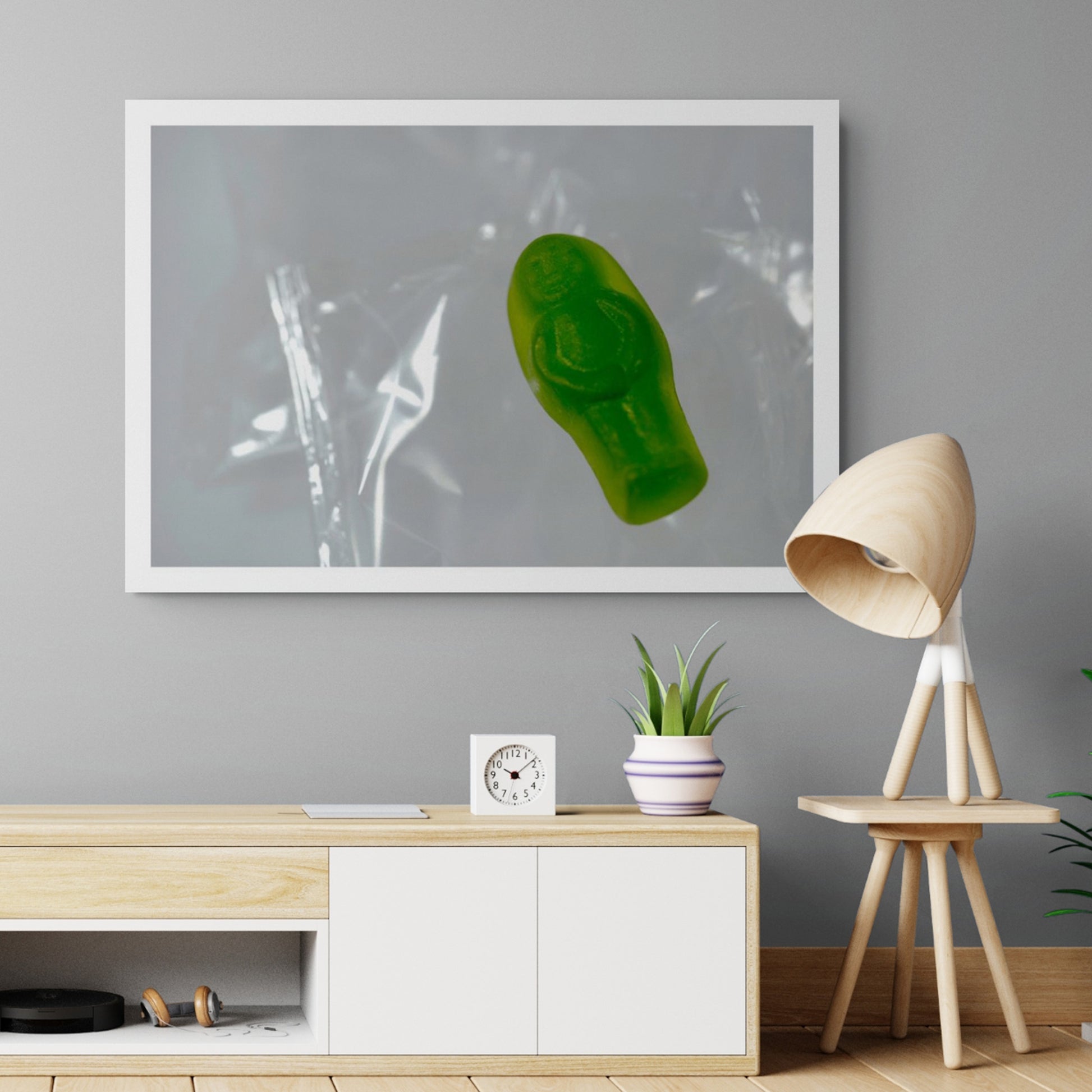 Sleep Like A Baby photographic artwork featuring a solitary green translucent baby-shaped figure displayed in a contemporary interior.