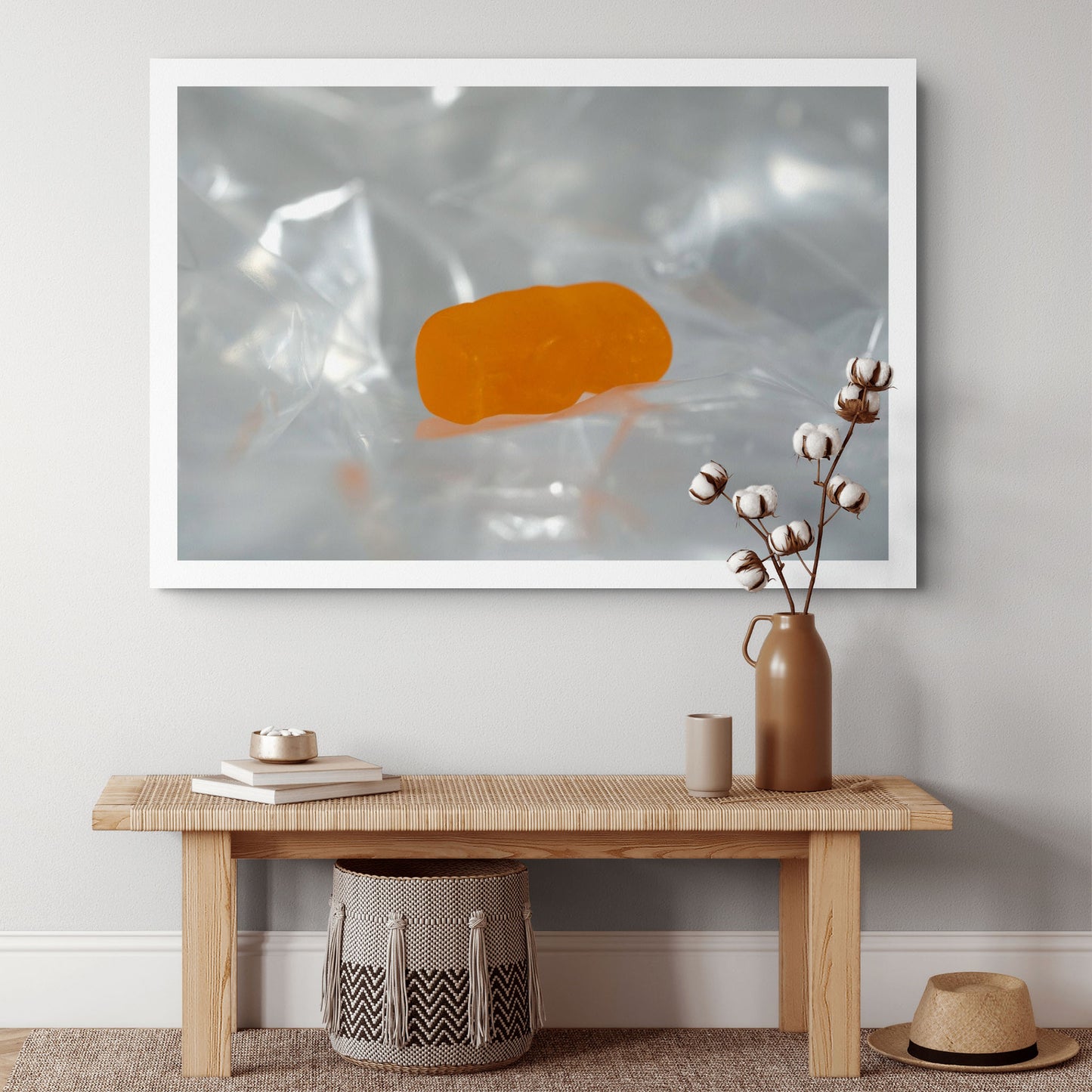 Sleep Like A Baby photographic artwork featuring a translucent orange baby-shaped figure resting within pale reflective folds, displayed in a contemporary interior.