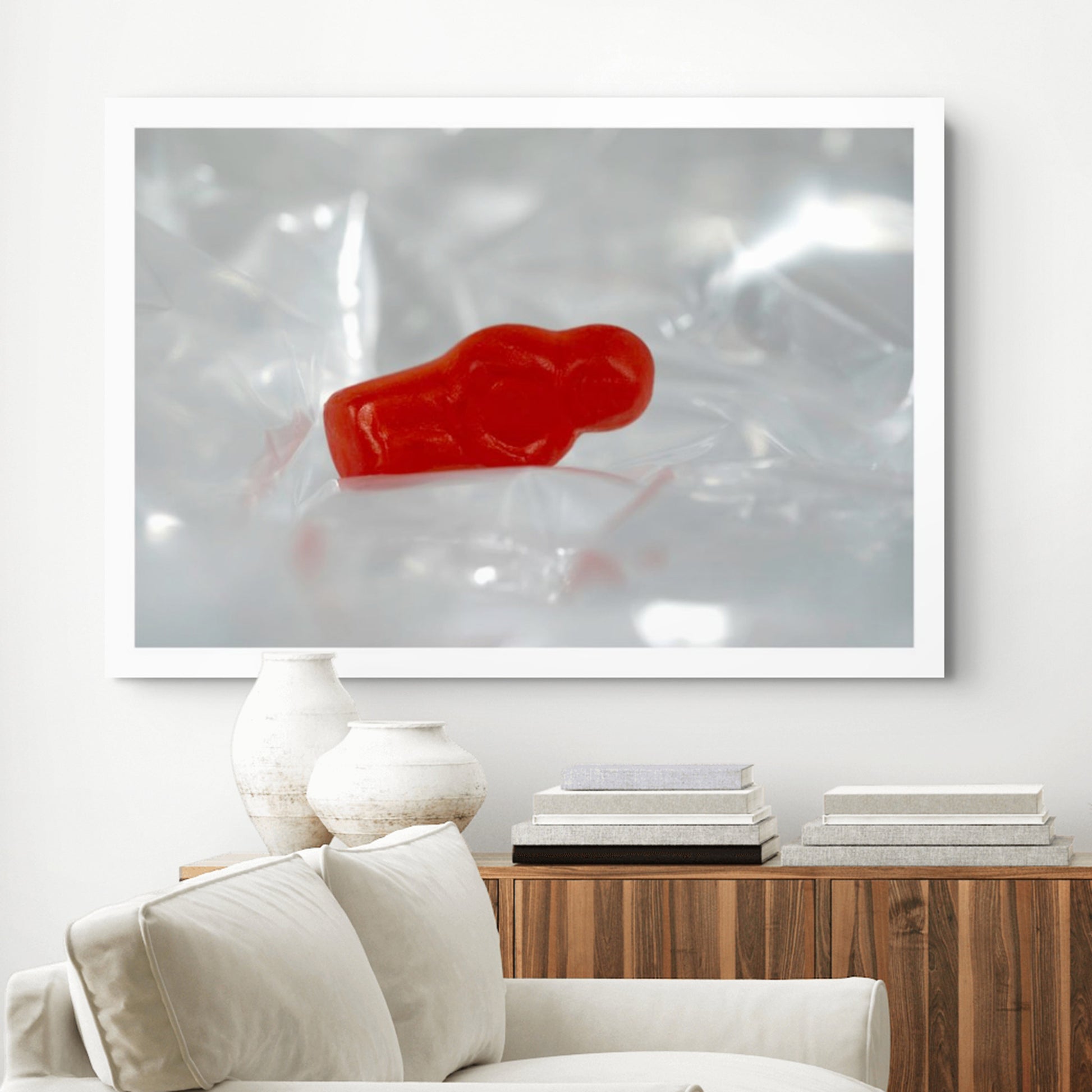 Sleep Like A Baby photographic artwork featuring a red translucent baby-shaped figure within pale reflective folds, displayed in a contemporary interior.