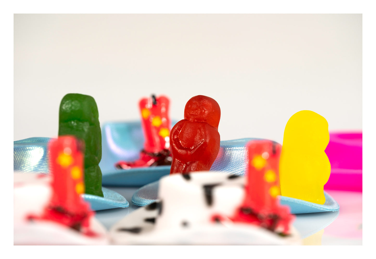 Boot Scootin Baby by Australian photographer Raymond Mather, colourful jelly baby figurines with miniature cowboy hats and boots, ART1.