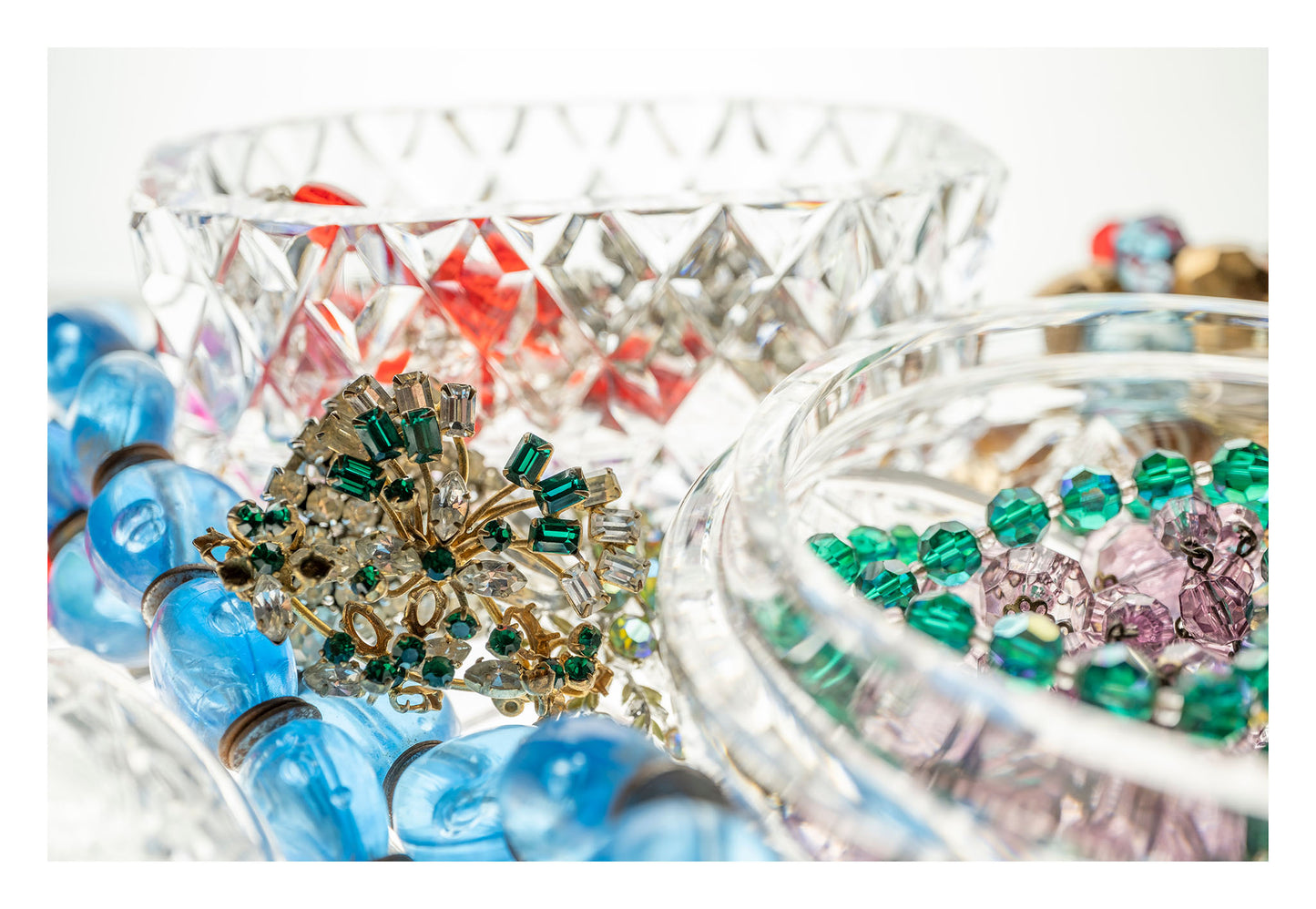 Still Life artwork of blue, green, red, gems and jewels in crystal boxes by Australian photographer Raymond Mather at ART1 Fine Art Photography, with white border allowance view.