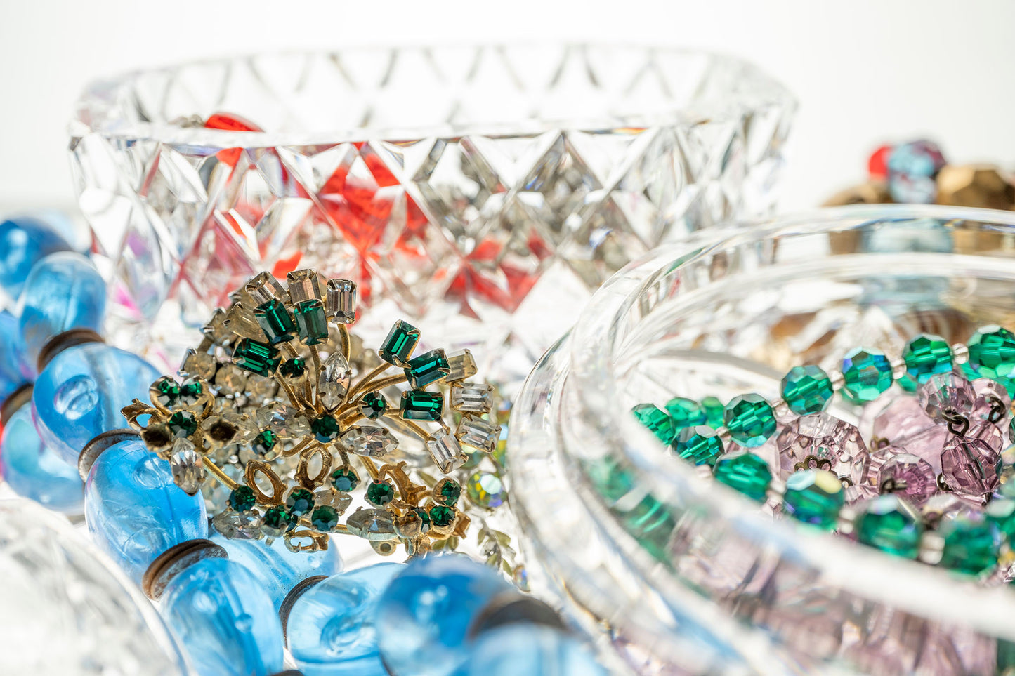 Still Life artwork of blue, green, red, gems and jewels in crystal boxes by Australian photographer Raymond Mather at ART1 Fine Art Photography, full view.