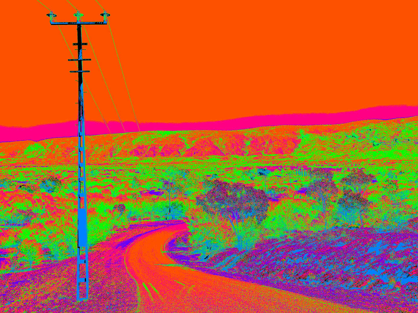 Vivid Country - Alice Springs Flinders Ranges -1243-4v1 - 90x67.5cm, a vibrantly stylised outback landscape with a lone power pole beside a winding road. Hyper-saturated colours depict red-orange skies, glowing magenta ridges, and neon green desert scrub, creating a surreal, psychedelic take on the Australian interior.