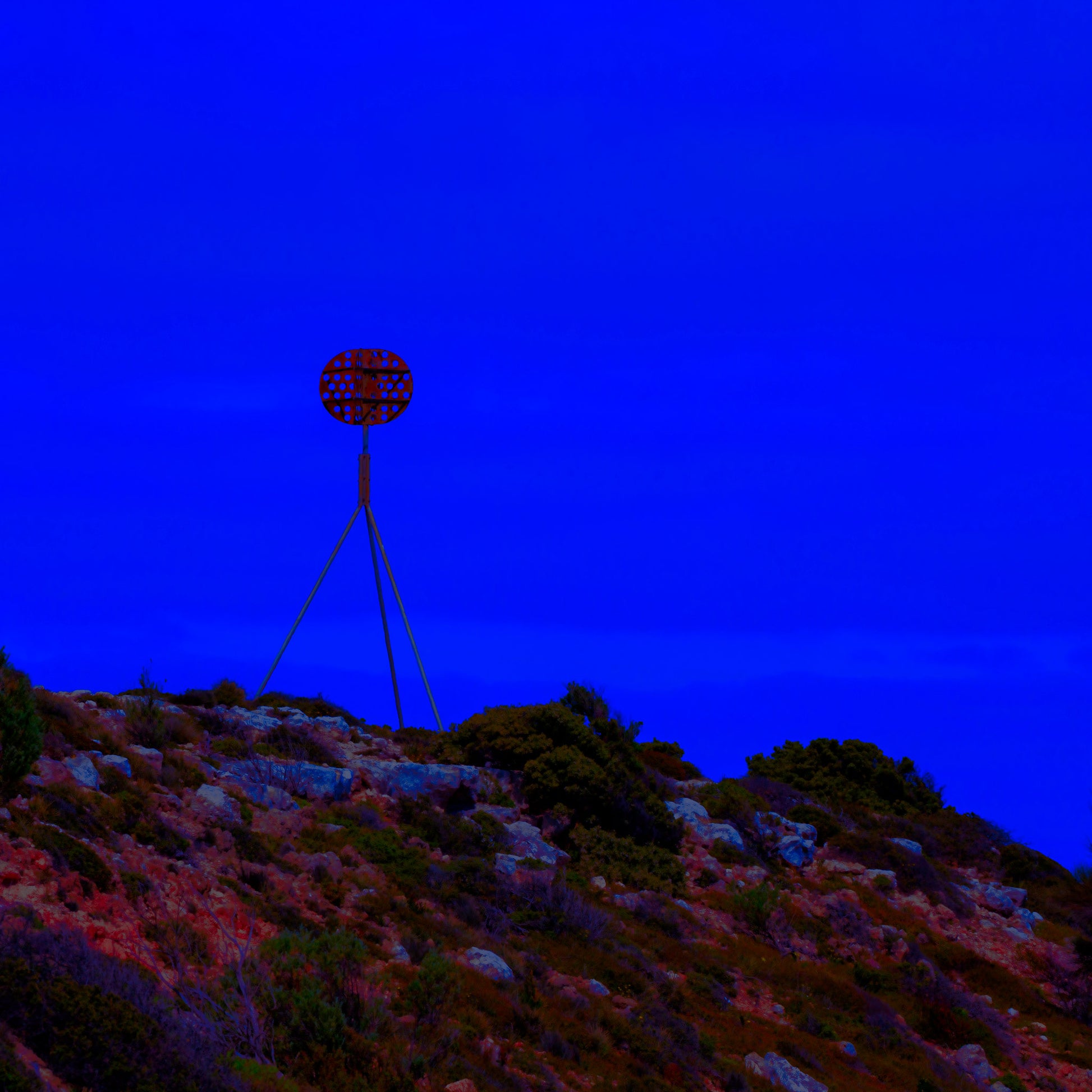 Vivid Country - Cape Jervis Heysen Trail - 7290v2 - Close Detail View, a lone marker on the Heysen Trail stands atop a rocky hill under a vivid cobalt blue sky, evoking solitude and direction on South Australia’s coast.