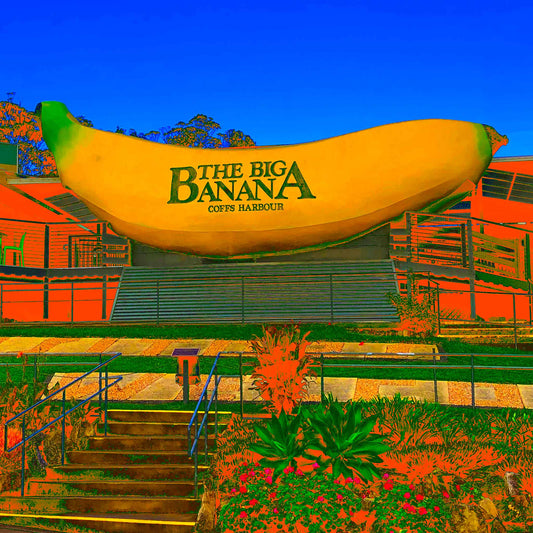 Vivid Country - Coffs Harbour Big Banana - 2173v56a - Close Detail View, a vibrant Pop Art interpretation of the iconic Big Banana roadside attraction, set against a bright blue sky with exaggerated orange and green foreground.