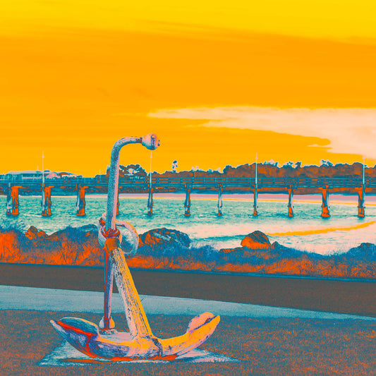 Vivid Country - Coffs Harbour Jetty Anchor - 6164v18 - Close Detail View, a pop-art style fine art print featuring a rusted maritime anchor in the foreground with a long wooden jetty stretching across the water under a glowing yellow-orange sky.