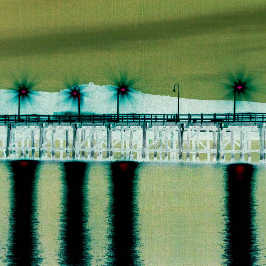 Vivid Country - Coffs Harbour Jetty Lights - 6900033v33a - Close Detail View, an ethereal nighttime view of the Coffs Jetty with bright starburst lights casting vivid pink and green reflections across still waters in a surreal, digitally enhanced composition.