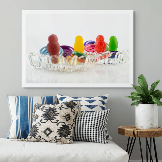 Cute As a Button 2546 - Room View, colourful jelly baby figures posed among large plastic buttons in a vintage-style cut glass dish, fine art photographic print by Raymond Mather, ART1.